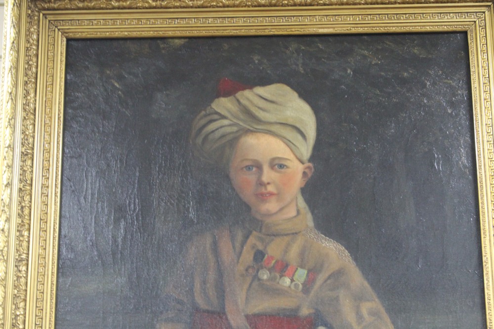 English School 1899, oil on canvas, Portrait of a boy wearing a turban and army uniform, indistinctly initialled and dated 1899, 98 x 6